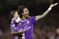 <p>Real Madrid’s Marcelo celebrates with family after winning the UEFA Champions League Final </p>