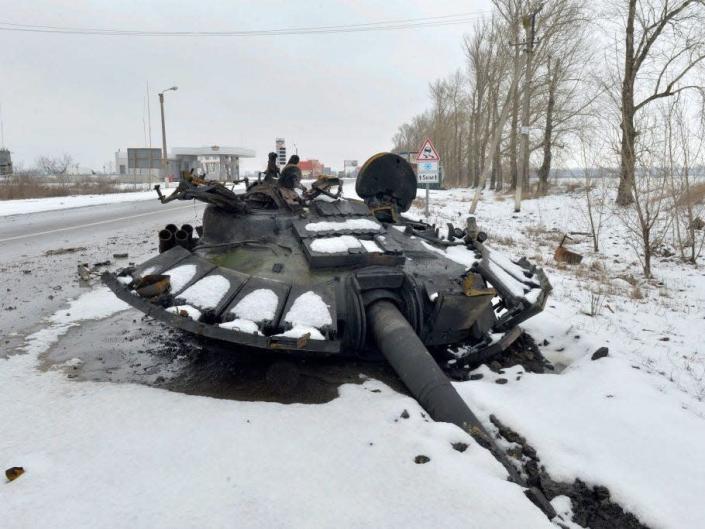 A fragment of a destroyed Russian tank is seen on the roadside on the outskirts of Kharkiv on February 26, 2022.