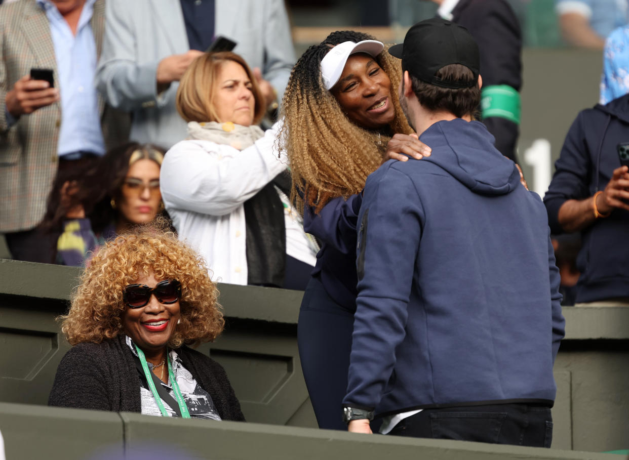 Oracene Price and Venus Williams are seen in the stands as Serena Williams goes up against Harmony Tan of France in the Women's Singles First Round Match on day two of The Championships Wimbledon on June 28, 2022 in London. (Clive Brunskill / Getty Images)