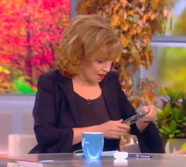 Joy Behar struggles to turn off her smartphone during the opening minutes of 