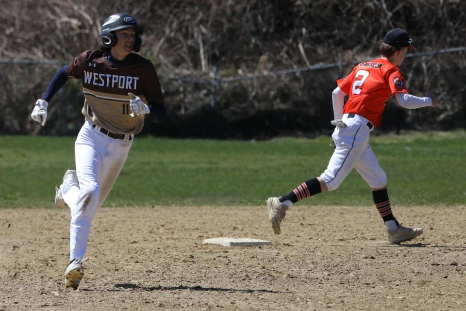 Westport’s Luke Finglas rounds second base against Diman.