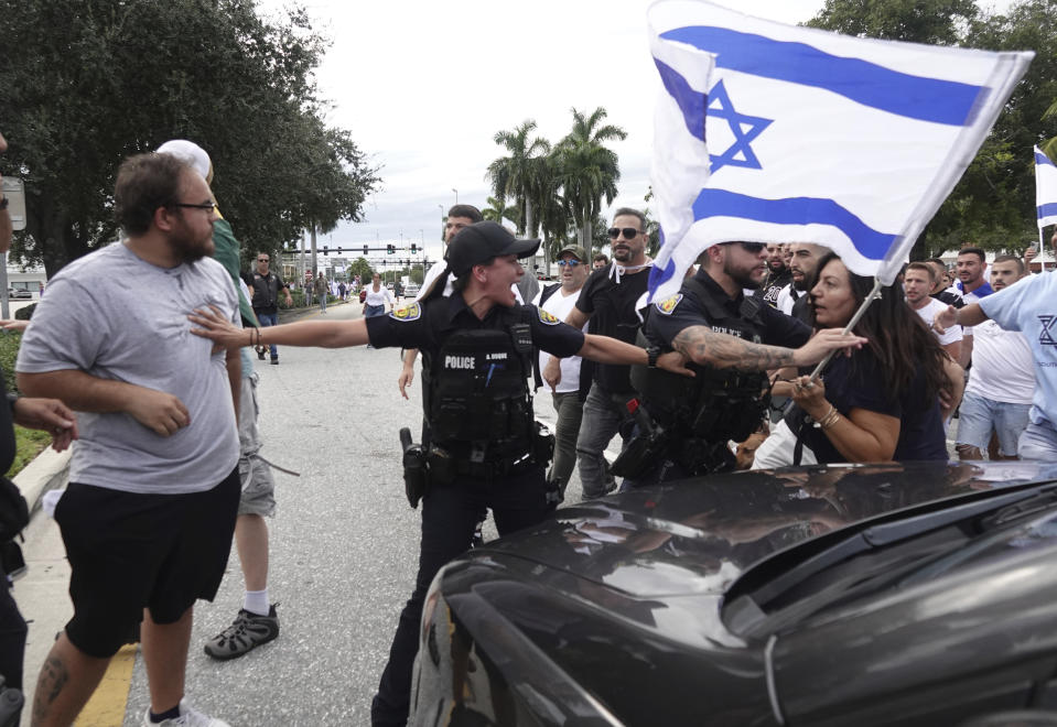 FILE - Fort Lauderdale police separate members of pro-Israel and pro-Palestinian protests, Sunday, Oct. 8, 2023, in Fort Lauderdale, Fla. State lawmakers across the country are expected consider legislation related to the Israel-Hamas war in 2024. (Joe Cavaretta/South Florida Sun-Sentinel via AP, File)