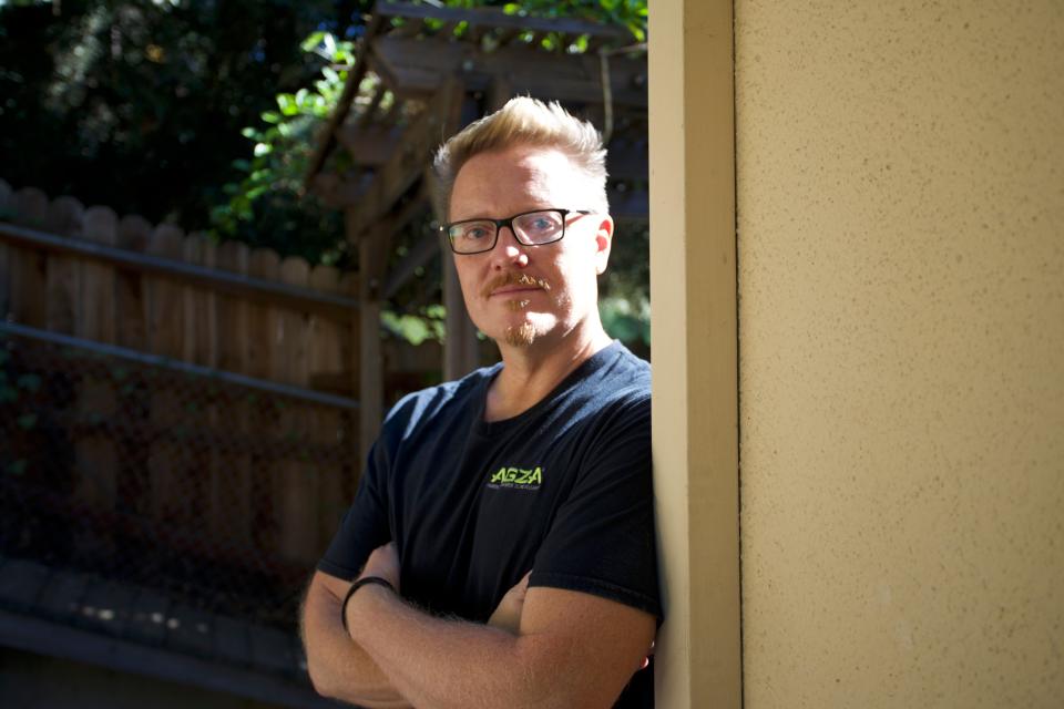 Luke Massman-Johnson outside his Los Angeles home. Massman-Johnson gave up his career and radically changed his lifestyle because of anxiety over climate change. (Hayley Smith)