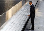 <p>President Barack Obama touches the names of victims engraved on the side of the north pool of the World Trade Center site during ceremonies marking the 10th anniversary of the 9/11 attacks on the World Trade Center, in New York September 11, 2011. (Larry Downing/Reuters) </p>