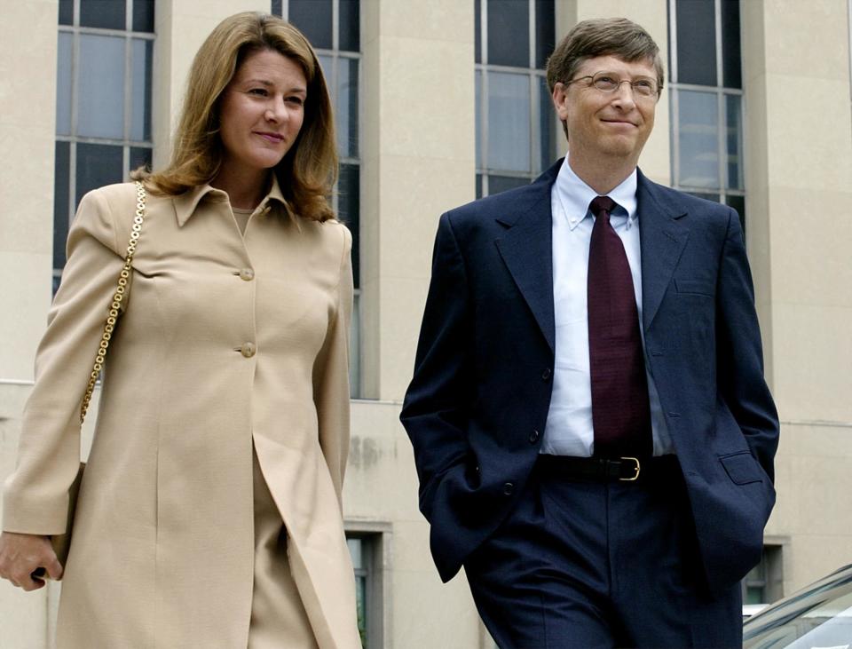 Microsoft Chairman Bill Gates (R) and his wife Melinda (L)walk toward the media for some brief comments at the US District Courthouse 22 April 2002 in Washington, DC. Gates is fighting the antitrust case brought by nine states and says that his company would 
