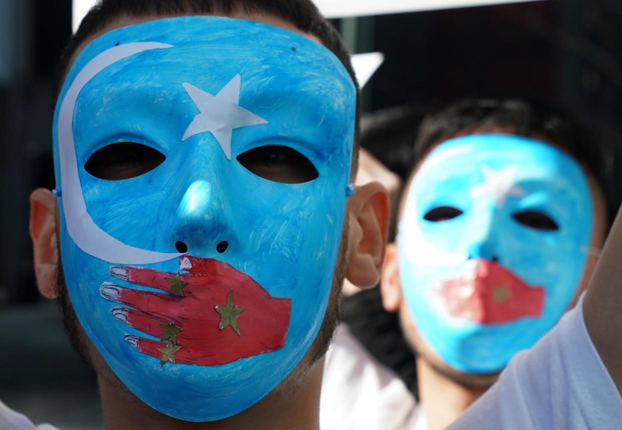 <p>Pro-Uighur protesters outside the United Nations in New York</p> (AFP/ Getty)