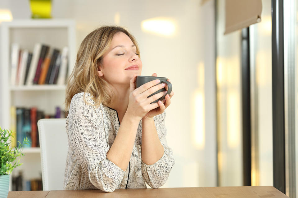 Woman enjoys cup of tea