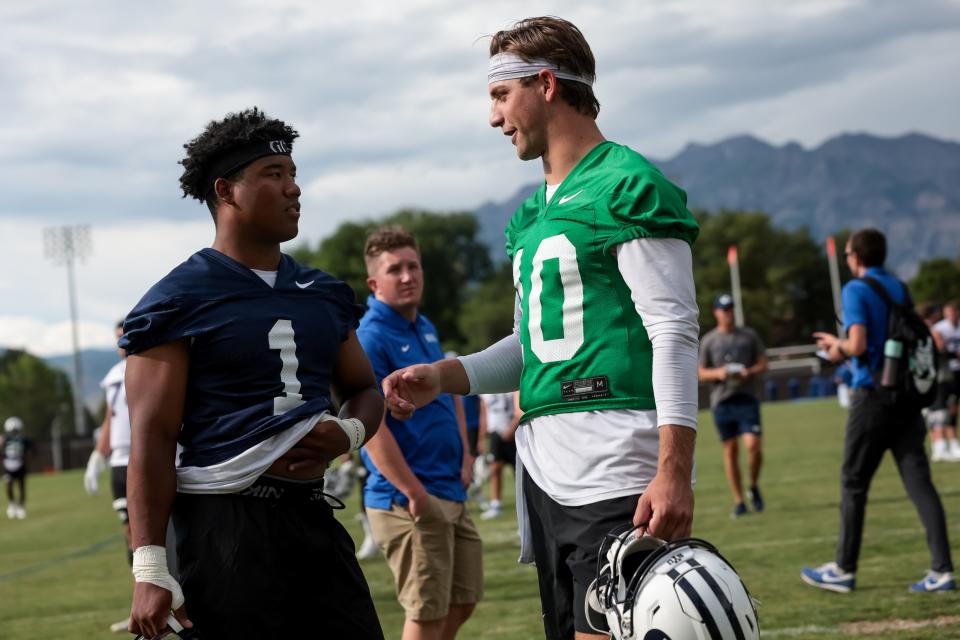 BYU Cougars football wide receiver Keanu Hill and quarterback <a class="link " href="https://sports.yahoo.com/ncaaf/players/299228" data-i13n="sec:content-canvas;subsec:anchor_text;elm:context_link" data-ylk="slk:Kedon Slovis;sec:content-canvas;subsec:anchor_text;elm:context_link;itc:0">Kedon Slovis</a> talk after practice at Brigham Young University in Provo on Tuesday, Aug. 1, 2023. | Spenser Heaps, Deseret News
