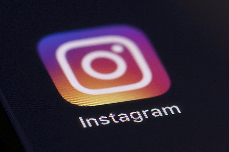 FILE - This Friday, Aug. 23, 2019, file photo shows the Instagram app icon on the screen of a mobile device in New York. Bowing to pressure from lawmakers, critics, the media and child development experts, Facebook said Monday, Sept. 27, 2021, it will “pause