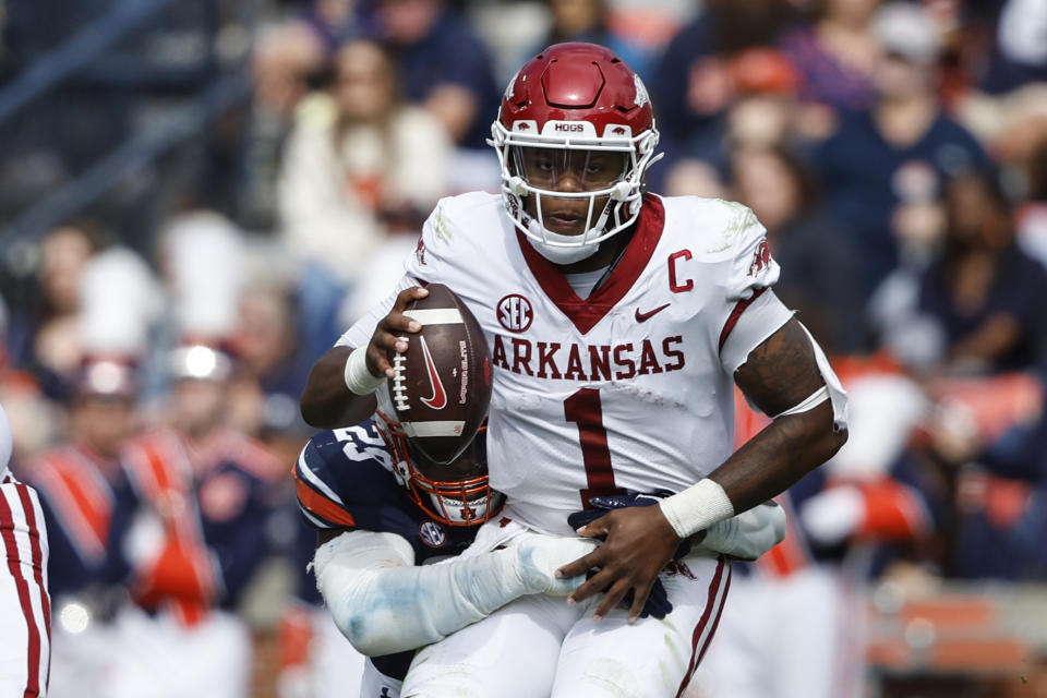 Arkansas quarterback KJ Jefferson (1) is sacked by Auburn defensive end Colby Wooden (25) during the first half of an NCAA college football game Saturday, Oct. 29, 2022, in Auburn, Ala. (AP Photo/Butch Dill)