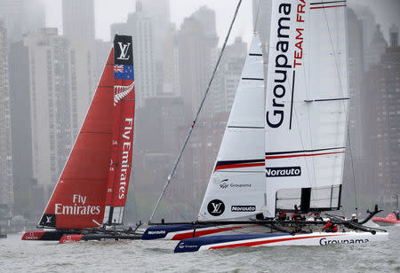 AC45F racing sailboats Emirates Team New Zealand (L) and Groupama Team France sail past lower Manhattan during practice racing ahead of the America's Cup World Series sailing event in New York, May 6, 2016. REUTERS/Mike Segar