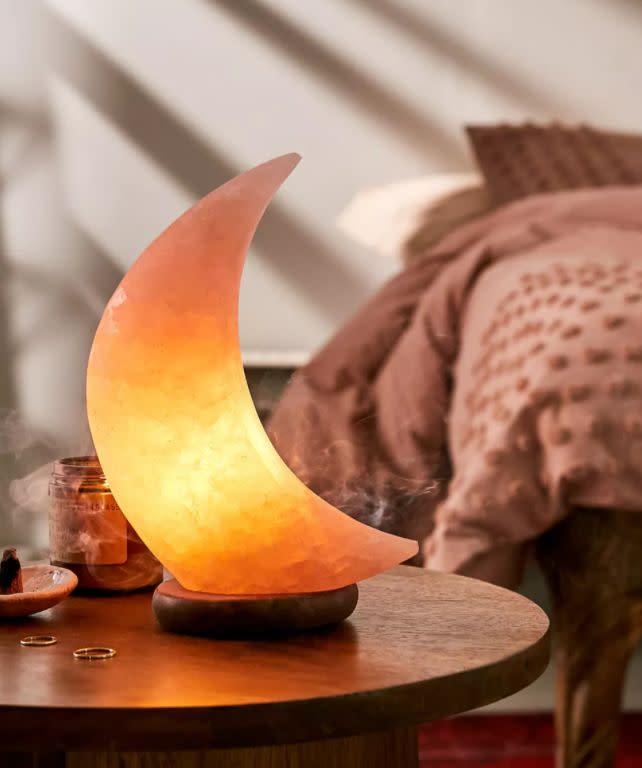 Find this <a href="https://fave.co/3n7wNm8" target="_blank" rel="noopener noreferrer">Moon Himalayan Salt Lamp for $59</a> at Urban Outfitters.