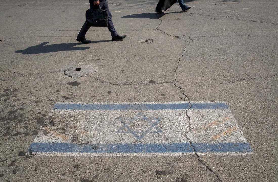 An Israeli flag is seen in downtown Tehran on Sunday. 