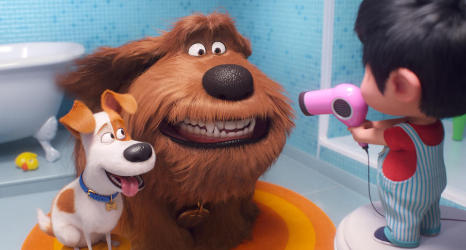 This image released by Universal Pictures shows Max, voiced by Patton Oswalt, from left, Duke, voiced by Eric Stonestreet and Liam, voiced by Henry Lynch in a scene from "The Secret Life of Pets 2." (Illumination Entertainment/Universal Pictures via AP)