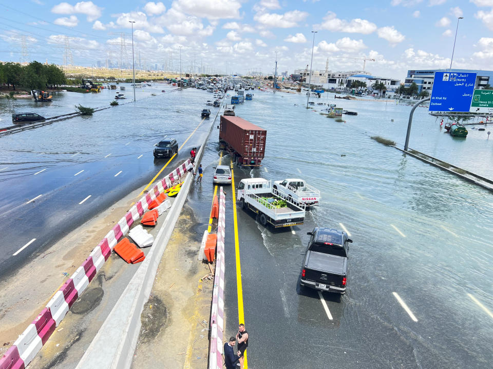 Cars are left submerged in floodwaters after a rainstorm hit Dubai.