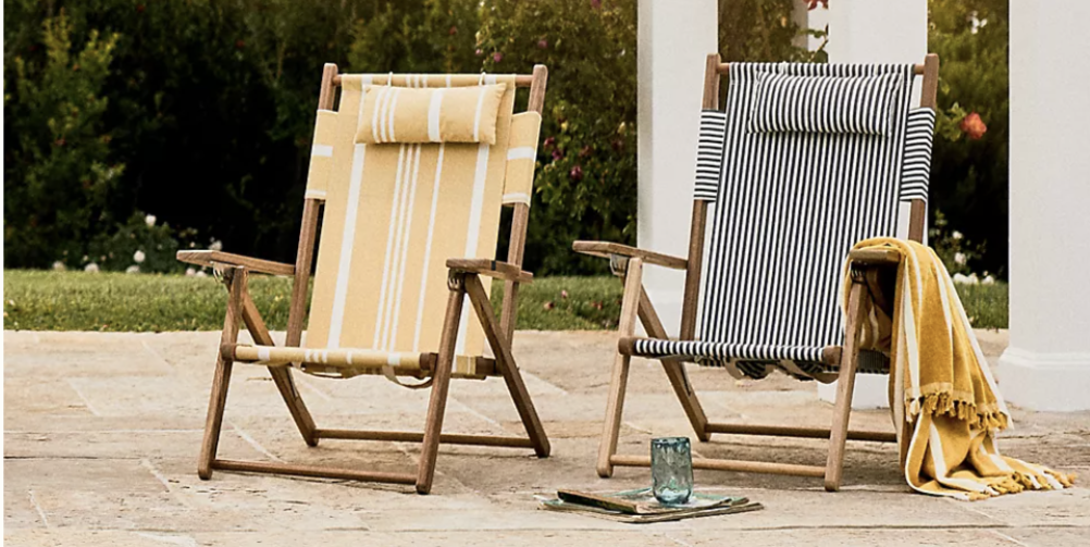 a set of two outdoor chairs by a pool