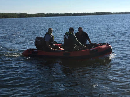 A crew from the Pasco Sheriff's office work at the scene of a plane crash where retired Major League Baseball pitcher Roy Halladay died, in New Port Richey, Florida, in this social media photo obtained November 7, 2017. Pasco Sheriff's Office/Social media/Handout via REUTERS