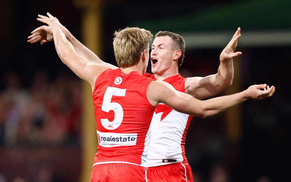 SYDNEY, AUSTRALIA - AUGUST 09: Isaac Heeney (left) and Chad Warner of the Swans celebrate during the 2024 AFL Round 22 match between the Sydney Swans and the Collingwood Magpies at The Sydney Cricket Ground on August 09, 2024 in Sydney, Australia. (Photo by Michael Willson/AFL Photos via Getty Images)