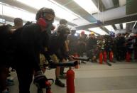 Protest at Yuen Long MTR station, the scene of an attack by suspected triad gang members a month ago, in Hong Kong