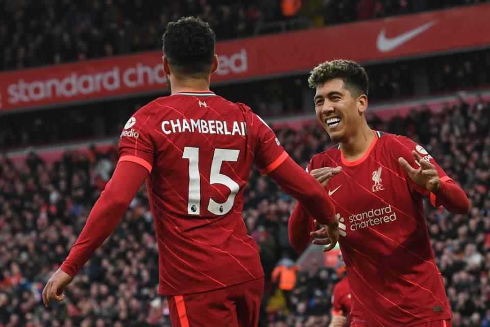 Oxlade-Chamberlain and Firmino celebrate the Reds’ second goal  (AFP via Getty Images)