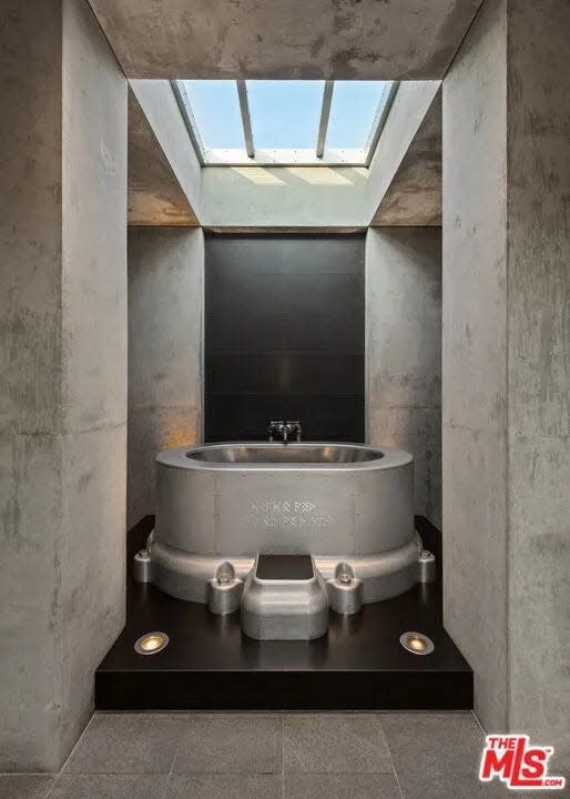 Metal bathtub inside bathroom in James Jannard's listed Beverly Hills mansion.