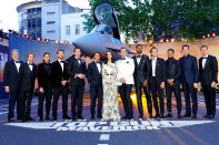 <p>The cast took five for a group photo in front of a plane brought to the red carpet for the starry occasion. </p>