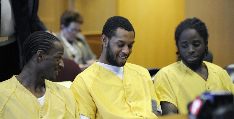 Defendants Wonzey Saffold, left, James Davis, center, and Latrez Cummings go before Judge Thomas Jackson, retired at Frank Murphy Hall of Justice, Monday, April 21, 2014, in Detroit. The four men who were accused of punching and kicking motorist, Steve Utash, who accidentally struck a 10-year-old Detroit boy, were ordered Monday to stand trial on attempted murder charges. (AP Photo/Detroit News, David Coates) DETROIT FREE PRESS OUT; HUFFINGTON POST OUT