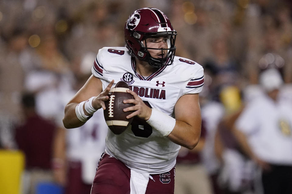 South Carolina quarterback Zeb Noland (8) rolls out to pass against Texas A&M during the first half of an NCAA college football game on Saturday, Oct. 23, 2021, in College Station, Texas. (AP Photo/Sam Craft)