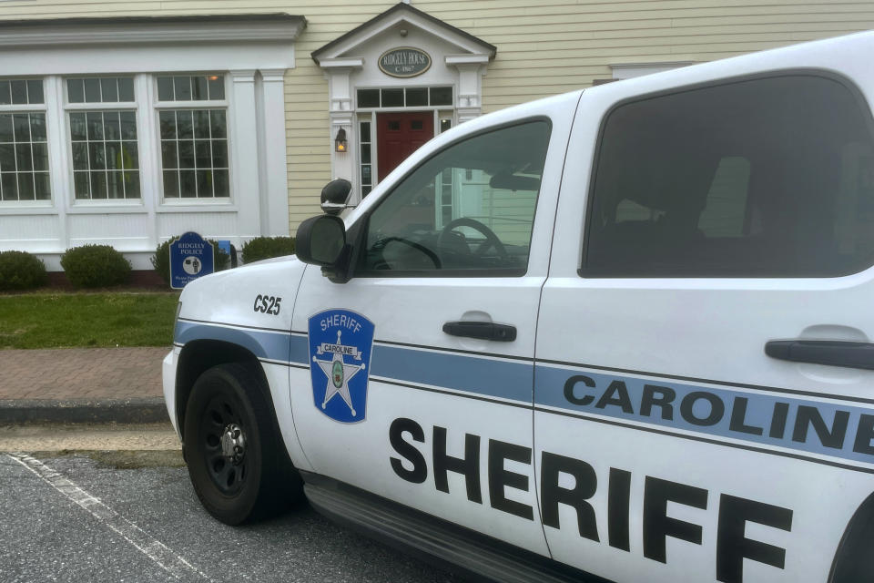 A Caroline County Sheriff’s Office vehicle is parked outside the town government and police department offices in Ridgely, Maryland, on Friday, March 15, 2024. Ridgely officials announced last week that their entire police department had been suspended pending the results of an investigation by state prosecutors. They made an arrangement with the sheriff’s office to cover calls for service in the meantime. (AP Photo/Lea Skene)