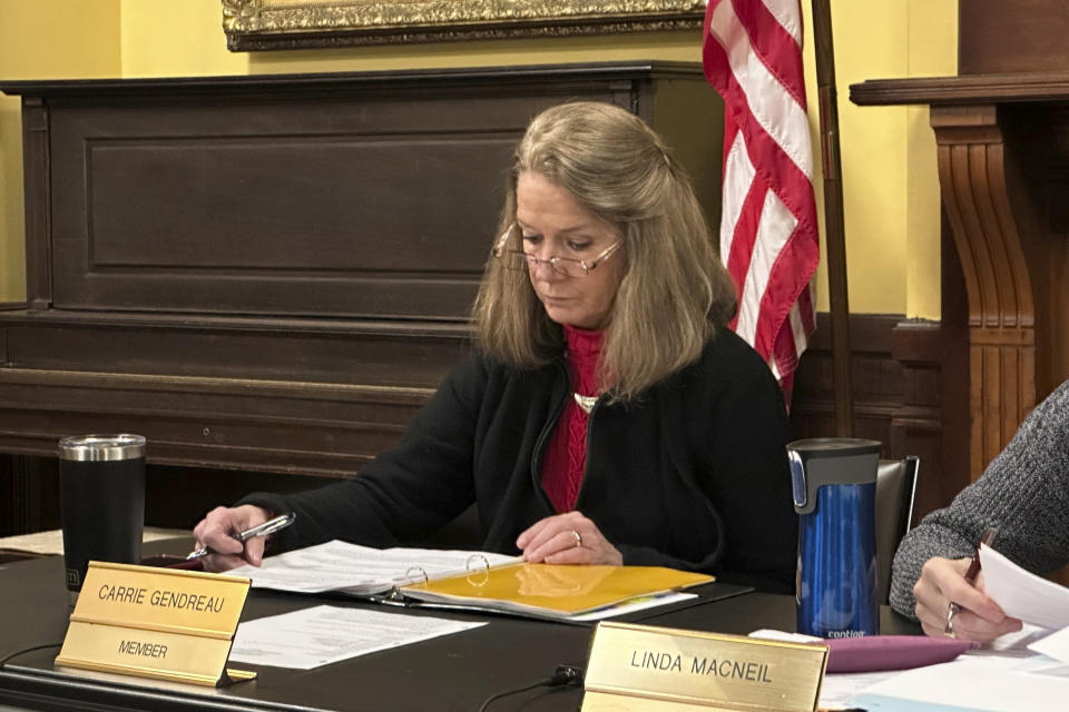 Littleton selectman Carrie Gendreau sits during a meeting on Jan. 22, 2024, in Littleton, N.H. Town manager Jim Gleason, whose late son was gay, resigned effective Friday, Feb. 2, 2024, to take a stand against the anti-LGBTQ sentiments being expressed by some people in Littleton. (AP Photo/Nick Perry)