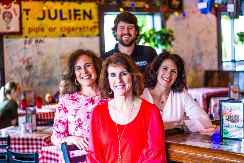 Thomas Boggs' three daughters and oldest son now run Huey's. Pictured are from left to right are Samantha Dean, Lauren Robinson and Ashley Robilio. Alex Boggs is in the back row.