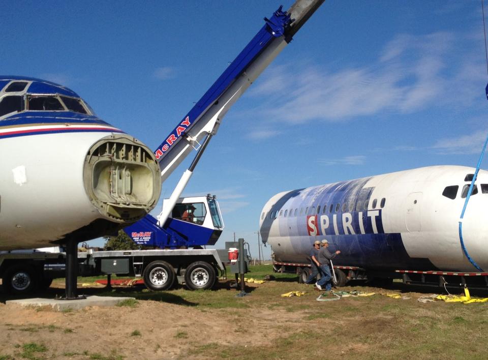 The DC-9 Spirit Airlines and MD-80 installed side-by-side to make two living structures.