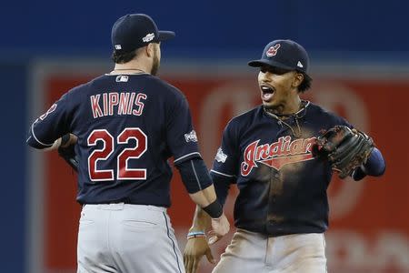Oct 17, 2016; Toronto, Ontario, CAN; Cleveland Indians shortstop Francisco Lindor (right) celebrates with second baseman Jason Kipnis (22) after game three of the 2016 ALCS playoff baseball series against the Toronto Blue Jays at Rogers Centre. Mandatory Credit: John E. Sokolowski-USA TODAY Sports