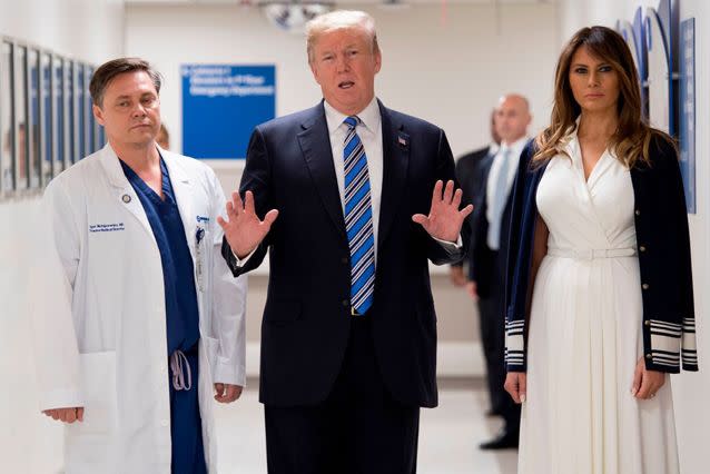 President Donald Trump, visiting victims with his wife Melania Trump, received US $30 million from the NRA during his election campaign. Source: Getty