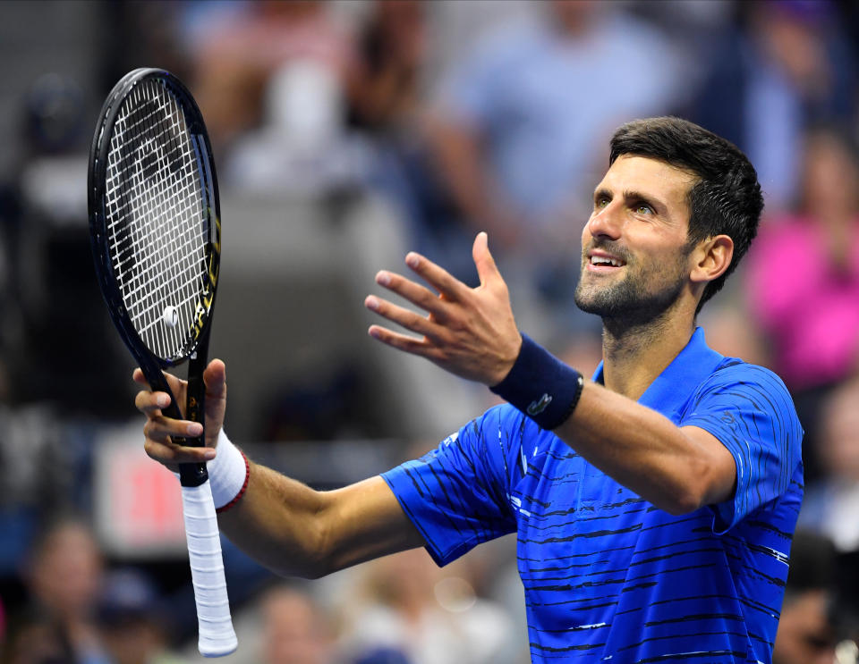 Novak Djokovic fought through shoulder discomfort to advance in straight sets Wednesday. (Getty)