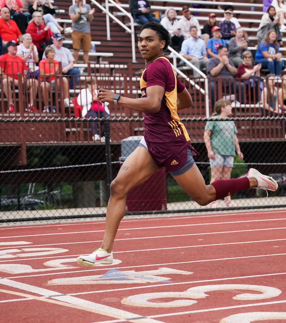 Bloomington North’s Jaidyn Johnson races to a win in the 200 meter dash in a meet record time of 21.66 seconds during the IHSAA boys’ track and field sectional championship at Bloomington North on Thursday, May 16, 2024.