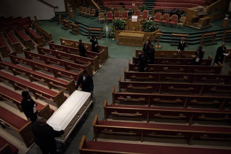 A casket containing the body of Freddie Gray is wheeled in before his funeral at New Shiloh Baptist Church in Baltimore, Maryland on April 27, 2015