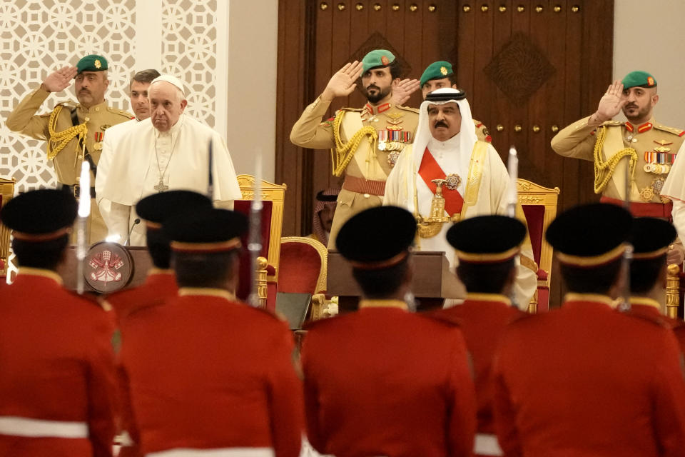 Pope Francis and Bahrain's King Hamad bin Isa Al Khalifa review a honor guard as they meet at the Sakhir Royal Palace, Bahrain, Thursday, Nov. 3, 2022. Pope Francis is making the November 3-6 visit to participate in a government-sponsored conference on East-West dialogue and to minister to Bahrain's tiny Catholic community, part of his effort to pursue dialogue with the Muslim world. (AP Photo/Alessandra Tarantino)