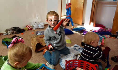 Stephanie Oakley's son, who suffers from a rare form of cancer, plays with his siblings in their new home in Oklahoma City, Oklahoma, U.S. November 26, 2018. REUTERS/Nick Oxford