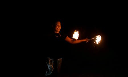 FILE PHOTO: A Filipino dancer performs on Boracay island in Philippines April 8, 2018. Picture taken April 8, 2018.  REUTERS/Erik De Castro/File Photo