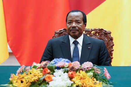 FILE PHOTO: President of Cameroon Paul Biya with Chinese President Xi Jinping (not pictured) attend a signing ceremony at The Great Hall Of The People in Beijing, China March 22, 2018. Lintao Zhang/Pool/File Photo