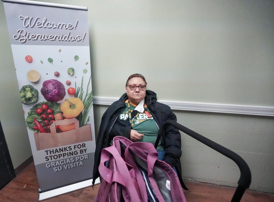 Denise Guzlecki, 60, says she’s going have to start coming to this food panty every week Saturday, Jan. 21, 2023, at Despensa De La Paz in Milwaukee. “I thank God that we have food pantries, because if not, a lot of people would go hungry,” she explained. “It is horrible to only be able to afford to live on tuna and a bag of fish. I haven’t been able to afford fresh fruits or meat. I know other people are hurting too.”