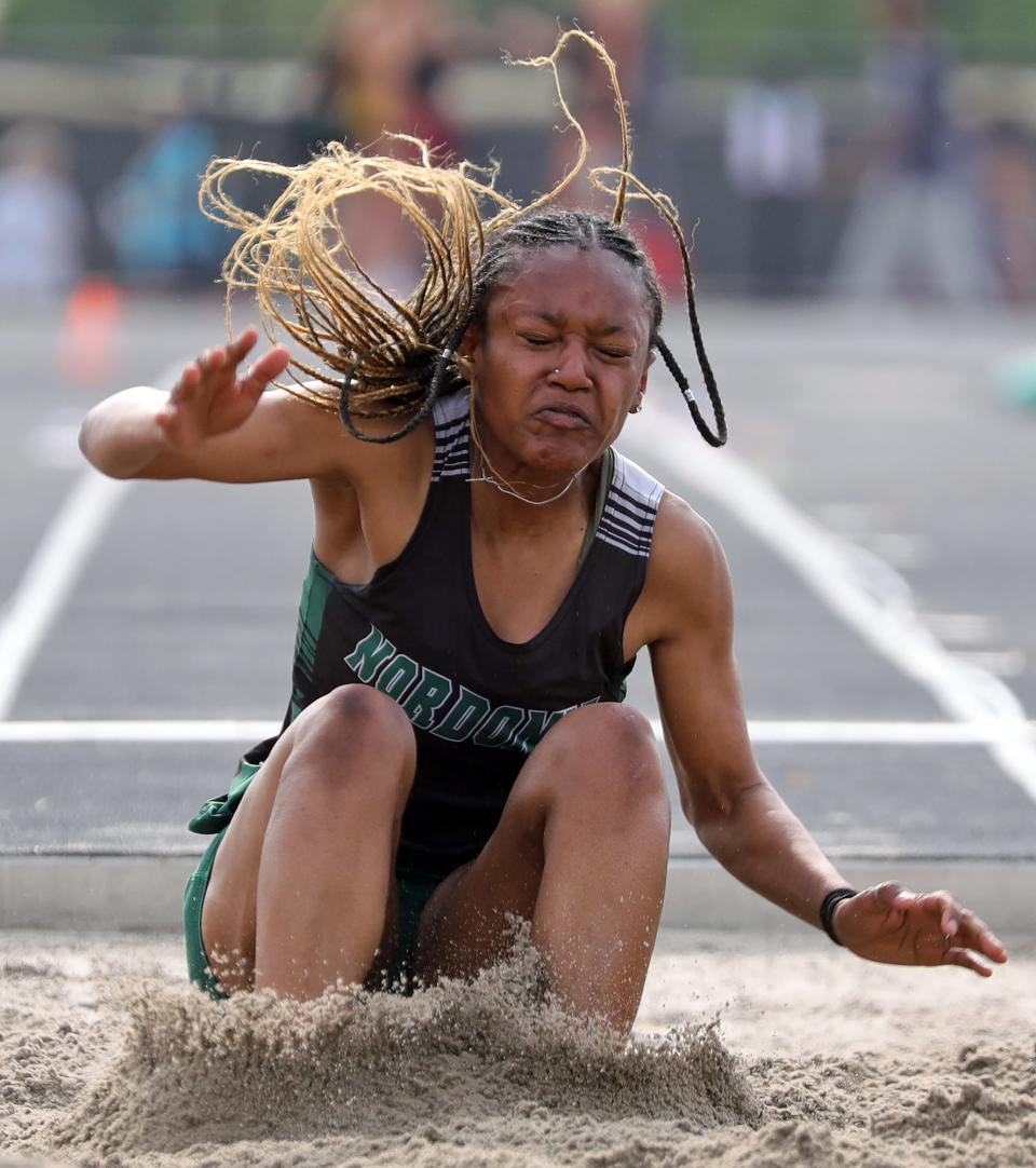 Nordonia's Alexis Hives wins the girls long jump with a jump of 18-0.50 during the Division I district track meet at Nordonia High School on Friday.