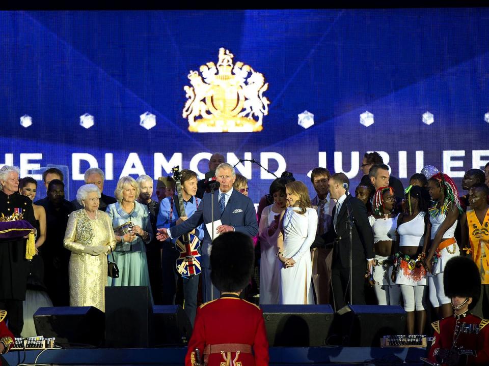 The Queen is joined on stage by musicians including Sir Paul McCartney at her 2012 Diamond Jubilee concert at Buckingham Palace (Rex)