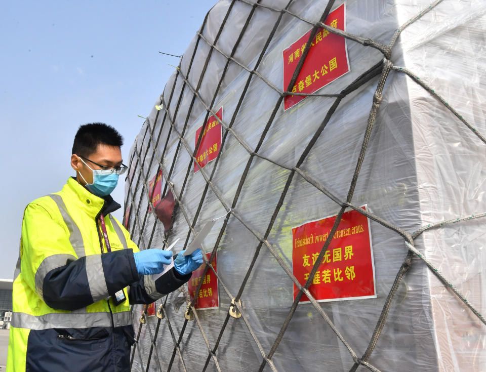 ZHENGZHOU, March 22, 2020 -- A staff member prepares to load donated materials onto a cargo plane at Xinzheng International Airport in Zhengzhou, capital of central China's Henan Province, March 22, 2020. The first batch of medical supplies donated by China's Henan Province, including 500,000 surgical masks and 100,000 pairs of medical gloves, departed from Zhengzhou on Sunday for Luxembourg by direct airline along the "Air Silk Road" linking Luxembourg with Zhengzhou to help Luxembourg fight the COVID-19. (Photo by Li Jianan/Xinhua via Getty) (Xinhua/Li Jianan via Getty Images)