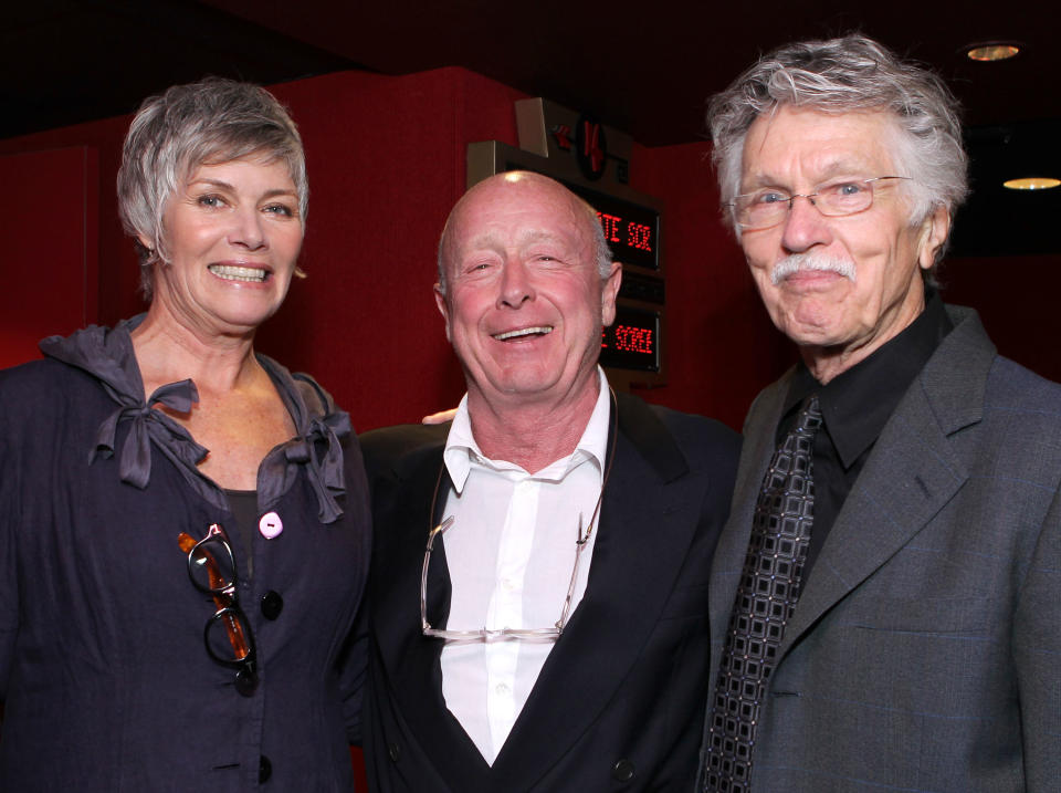 LOS ANGELES, CA - MAY 17:  Actress Kelly McGillis, director Tony Scott, and actor Tom Skerritt pose onstage before the screening of "Top Gun" during AFI & Walt Disney Pictures' "A Cinematic Celebration of Jerry Bruckheimer" held at the Mann Chinese 6 on May 17, 2010 in Los Angeles, California.  (Photo by Alexandra Wyman/Getty Images for AFI)