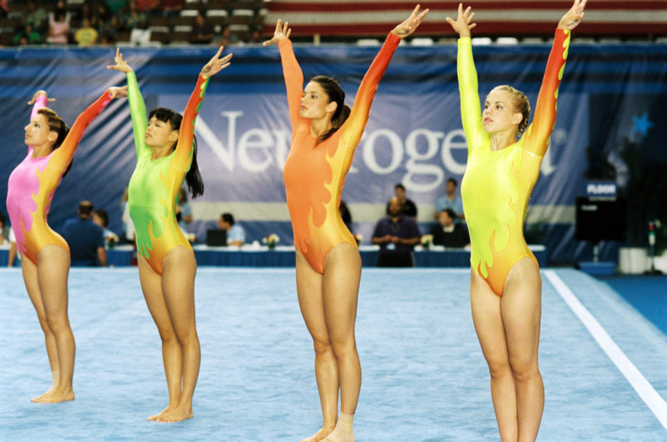 Wei Wei wearing a long sleeve unitard with flames