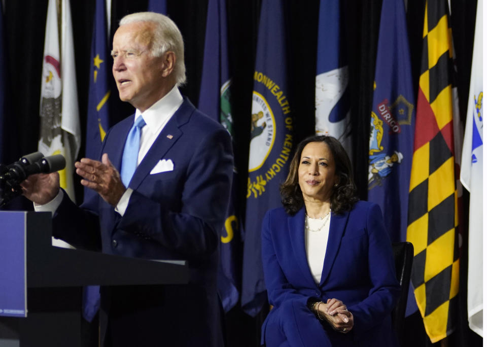 Democratic presidential candidate former Vice President Joe Biden, joined by his running mate Sen. Kamala Harris, D-Calif., speaks during a campaign event at Alexis Dupont High School in Wilmington, Del., Wednesday, Aug. 12, 2020. (AP Photo/Carolyn Kaster)