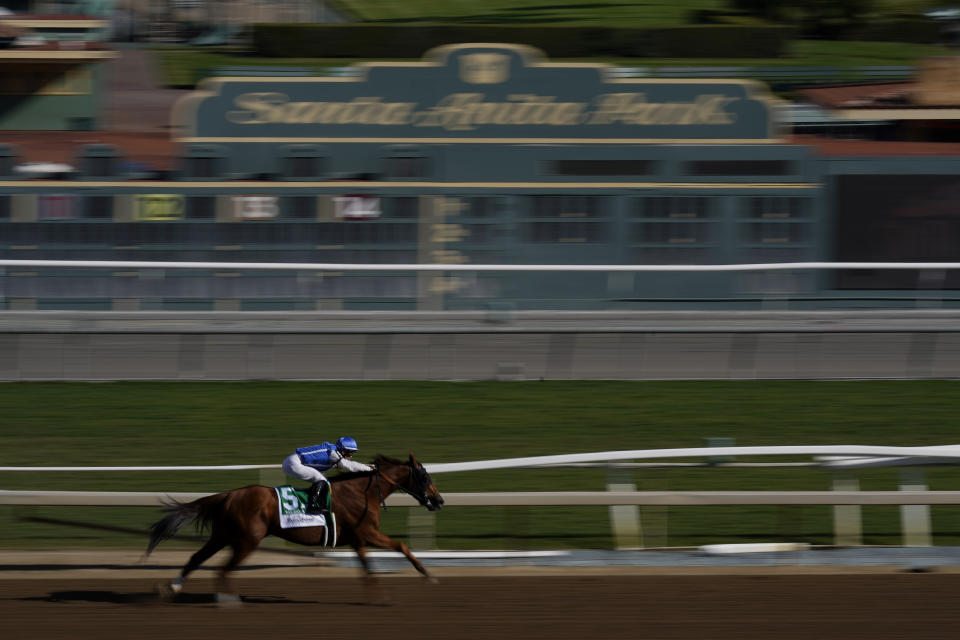 Flavien Prat rides Salesman to win the first race on the second day of Breeder's Cup horse races, Saturday, Nov. 4, 2023, at Santa Anita Park in Arcadia, Calif. The first race is not a Breeders' Cup Championship race. (AP Photo/Ashley Landis)