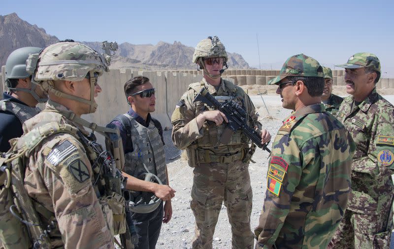 Advisors with the 1st Security Force Assistance Brigade's 3rd Squadron, speak with their Afghan National Army counterparts during a routine fly-to-advise mission at Forward Operating Base Altimur, Afghanistan, Sept. 19, 2018. (Sean Kimmons/Army)<cite class="op-small">Sean Kimmons</cite>